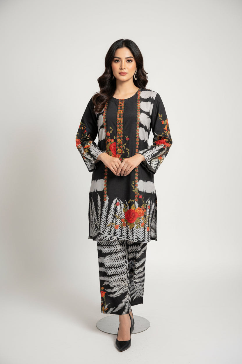 Mannequin wearing a colorful floral dress with gloves on a white surface.